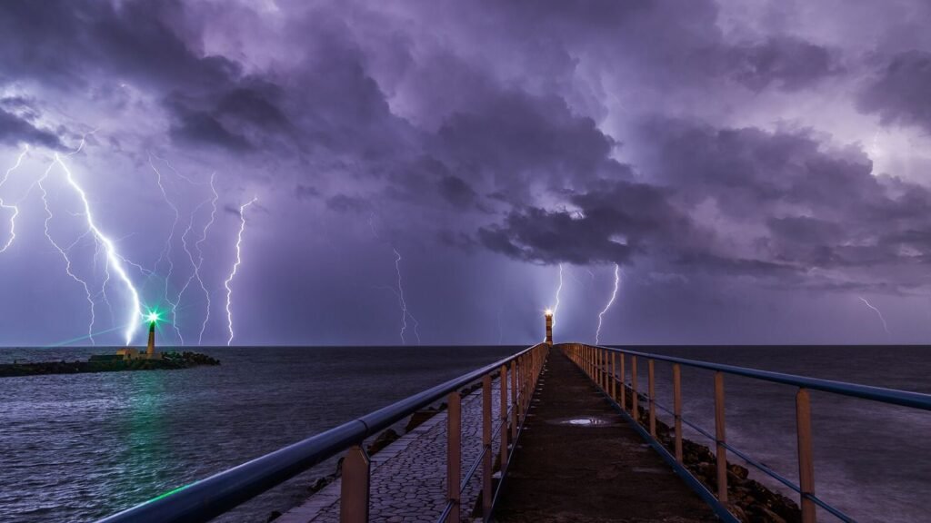 Forecasters Use Lightning Jumps to Spot Wildfire Ignition Risk bright lightning strike beneath heavy storm clouds at night
