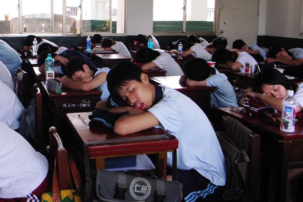 student resting after studying at a desk