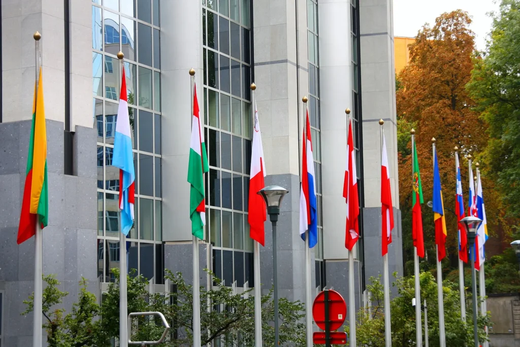 European Union member flags flying in front of the European Parliament in Brussels